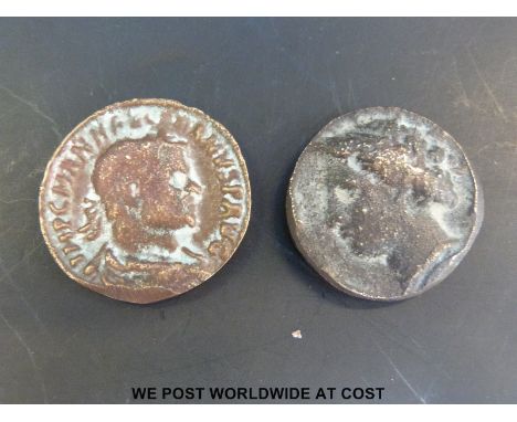 Two ancient bronze coins approximately 30mm diameter. Male bust obverse on one, with three standing female figures reverse.Fe