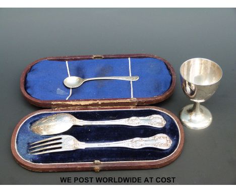 A cased Victorian hallmarked silver fork and spoon set and Chinese egg cup and spoon marked 90% silver by Tack Hing (106g)