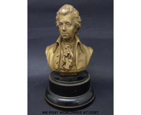 A bronze bust of Mozart on turned ebonised base, height 15cm