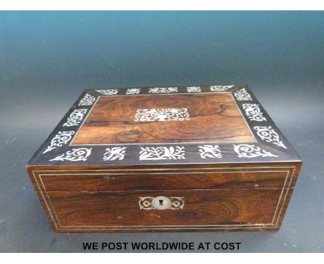 A 19thC rosewood and mother of pearl inlaid sewing or jewellery box with fitted interior, width 30cm