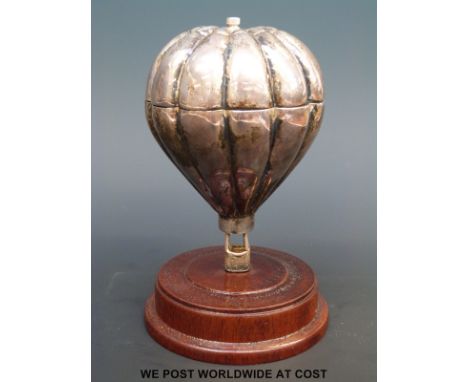 A hallmarked silver pepper grinder by Mark Stevens of Warwick in the form of a hot air balloon, B'ham 1997. According to Mill