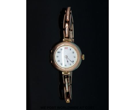 Rolex 9ct gold ladies wristwatch with Arabic numerals, gilt markers and white enamel face on 9ct gold expanding bracelet, cas