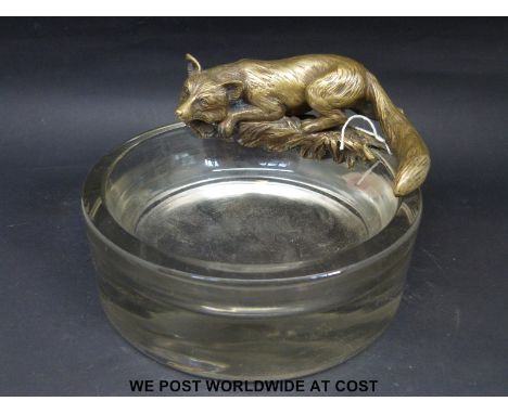 A glass dressing table or bon bon bowl with bronze fox to edge, diameter 15cm