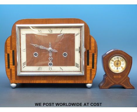 A brass inlaid mahogany clock