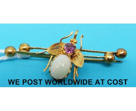 A Victorian brooch set with an amethyst and an opal in the form of a bee. 