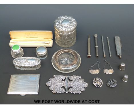 A quantity of hallmarked silver mounted dressing table items including a guilloche enamel example, further hallmarked silver 