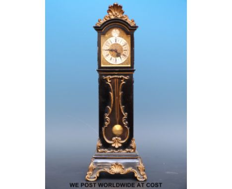A miniature long case clock in ebonised case, approximately 32cm tall