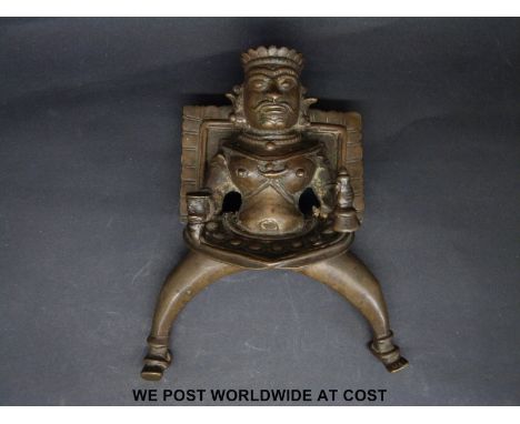 An Indian or similar bronze god, possibly an architectural fitting, height 16cm