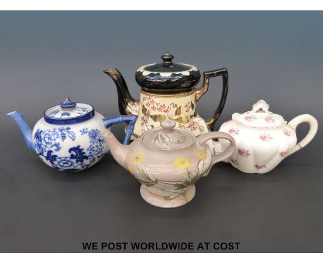 A James Macintyre faience teapot, Foley, Royal Doulton and a Victorian teapot. 