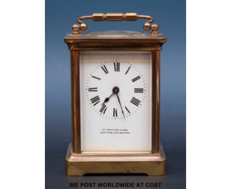 A William Bruford & Son, Exeter & Eastbourne brass corniche cased carriage clock with spade hands and Roman numerals on white