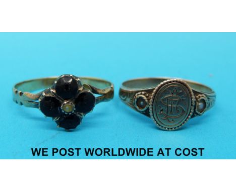 Two Georgian/Victorian rings, one set with seed pearls and the other garnets with a central seed pearl 