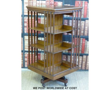 A three-shelf oak revolving bookcase (depth 60cm, width 60cm, height 119.5cm)