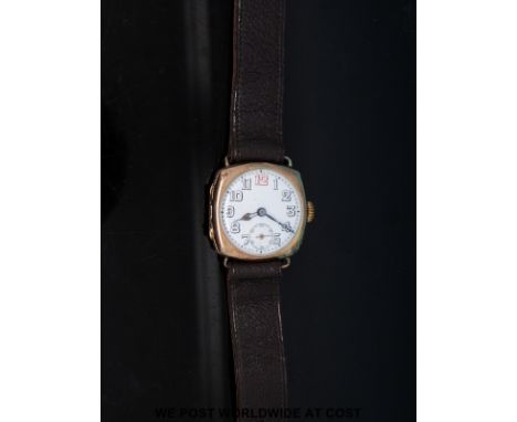 A 9ct gold gentleman's wristwatch with subsidiary seconds dial, blued skeleton hands and Arabic numerals on white enamel face