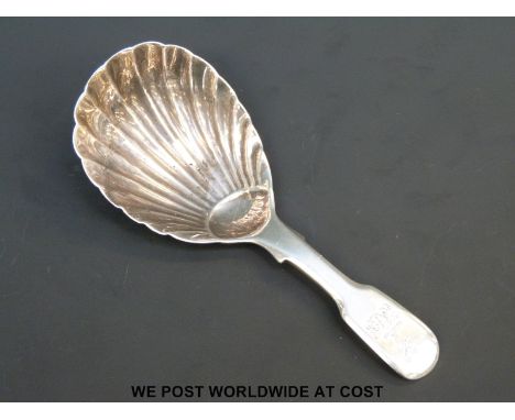 A Georgian hallmarked silver fiddle pattern caddy spoon with shell design to bowl, London 1825 maker Charles Eley, length 9cm