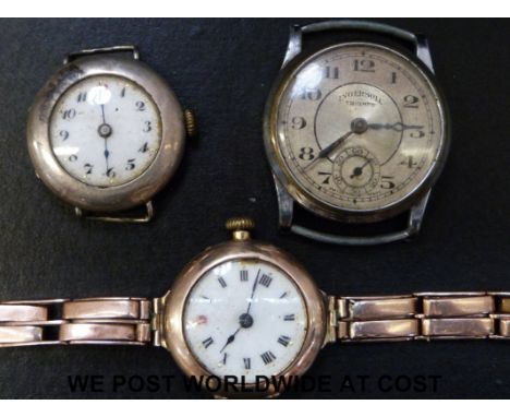 A 9ct gold ladies wristwatch with Roman numerals and enamel face on yellow metal strap (26g), a silver cased wristwatch and a