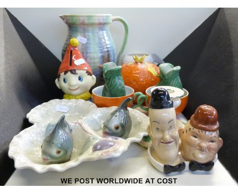 A small collection of Crown Devon including a small candlestick, an orange shaped teapot and two cups, a trefoil dish and a N