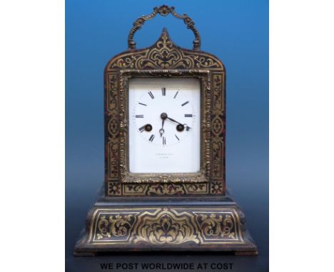 A boulle cased mantel clock with gilt handle and surround, the white enamel dial marked J Sewell & Co a Paris, the two train 