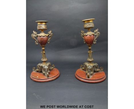 A pair of marble, bronze and part gilt candlesticks, the bases formed as elephants heads, height 19cm