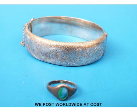 A Liberty and Co silver bangle and a Charles Horner ring set with enamel 