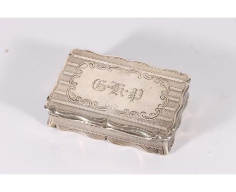 Victorian antique silver snuff box of rectangular form with serpentine edge, the body with engine turned decoration and large