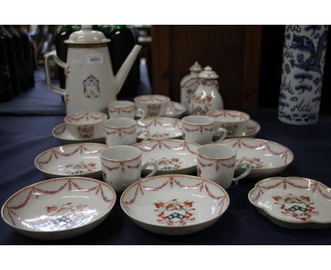 Chinese export armorial porcelain part coffee and tea set, late 18th century, painted in puce and iron red floral wreath bord