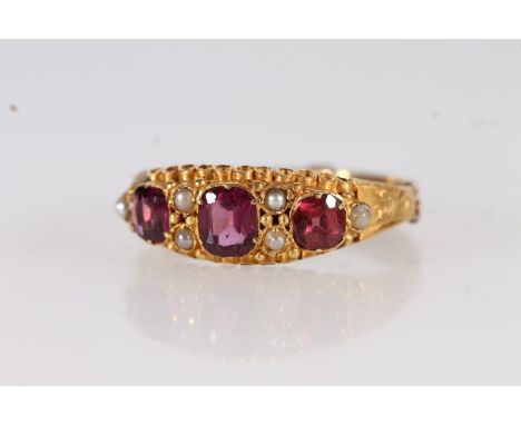 Victorian 15ct gold amethyst and seed pearl ring, the cushion cut amethysts with interspersed split pearls on a fancy mount w