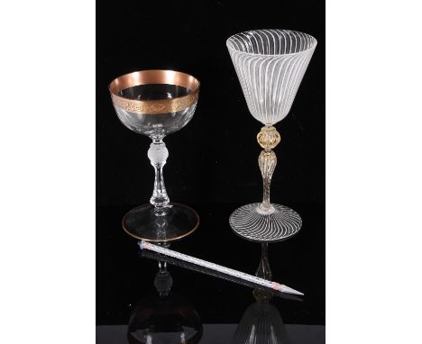 Venetian wine glass, early 20th century, the tapered lattimo threaded bowl over a wrythen aventurine stem on conforming foot,
