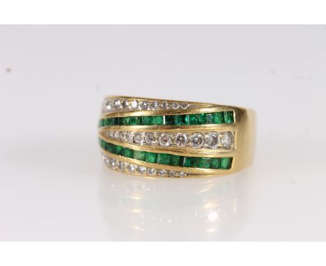 Modernist 18ct gold diamond and emerald ring, the graduated diamonds and emeralds pave and channel set in a plain gold band, 