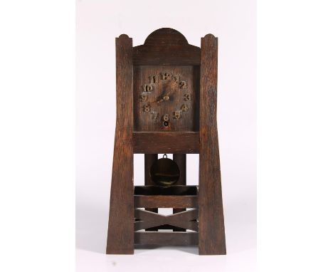 American mission style Arts and Crafts oak framed mantel clock, c1920, the castellated planked tapering frame with horizontal