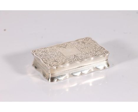 Silver snuff box of rectangular shape with serpentine edge, the top and bottom surface incised with floral sprays, blank rect