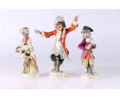 Three Meissen porcelain monkey orchestra figurines, 20th century, consisting of the Conductor and two others, max H17cm.  Pos