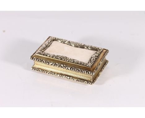William IV antique parcel gilt silver table size snuff box of rectangular form with concave sides having relief embossed flor