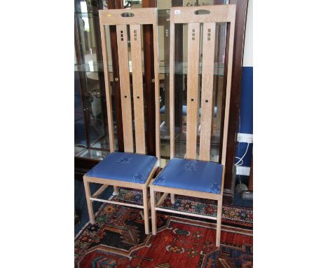 Pair of late 20thC Ingram high back light oak chairs after Charles Rennie Mackintosh, H151cm. 