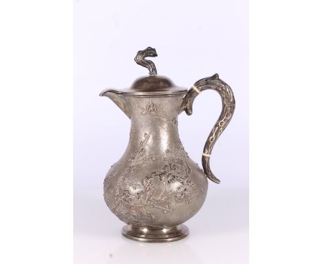 Chinese silver hot water jug, late 19th century, the hinged lid with naturalistic branch finial, matching loop handle on a pl