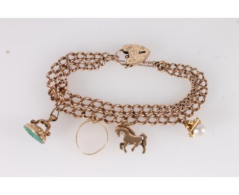 9ct gold charm bracelet, the double curb link bracelet with heart shaped clasp, three 9ct gold charms and 18ct gold ring, gro