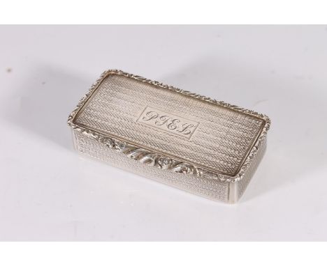 Georgian antique silver snuff box of rectangular form with engine turned decoration and embossed relief scrolling foliate bor