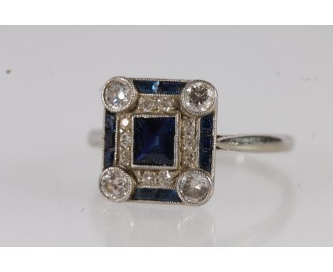 Art Deco 18ct white gold sapphire and diamond ring, the central square cut sapphire flanked by round cut diamonds and further
