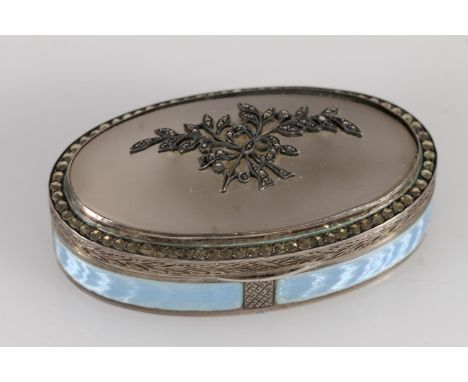 Continental 935 grade silver enamel and marcasite pill box of oval shape, the frosted glass top set with a spray of flowers, 