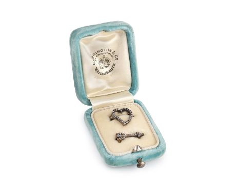 A pair of late 19th/early 20th century diamond brooches, designed as an openwork heart and an arrow, each accented with rose 