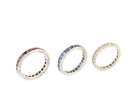 A sapphire full hoop eternity ring, channel set throughout with square and rectangular step-cut sapphires, the white precious