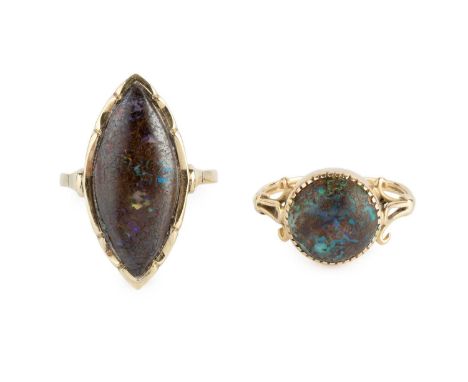 Two boulder opal dress rings, the first with a navette-shaped cabochon boulder opal in fluted collet setting, with Dutch leaf