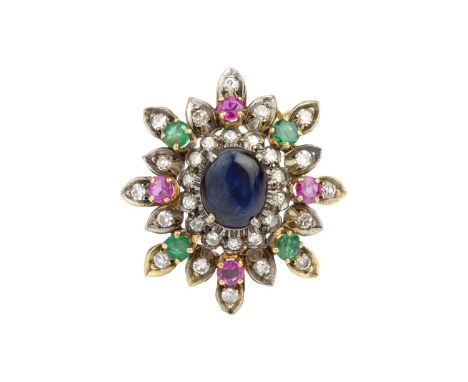 A diamond and vari gem-set cluster brooch, centred with an oval cabochon sapphire in claw setting, within a tiered border of 
