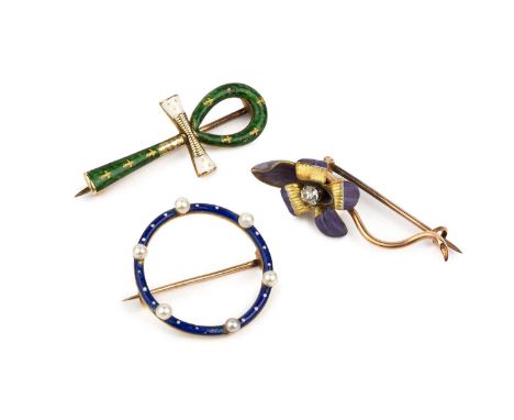 Three enamel brooches, the first modelled as a purple enamel flowerhead, with central old-cut diamond highlight, the second m