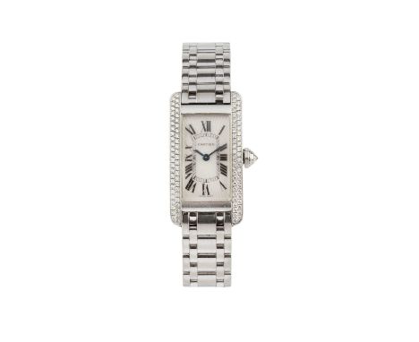 A lady's 18ct white gold and diamond set 'Tank Américaine' bracelet watch by Cartier, the rectangular silvered engine-turned 