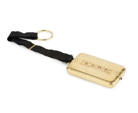A yellow precious metal and diamond set minaudière, of canted rectangular form, having engine turned and engraved decoration,