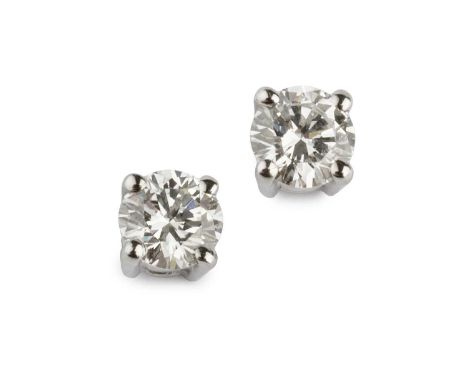 A pair of diamond ear studs, each round brilliant-cut diamond in four claw setting, platinum mounted, with butterfly fittings