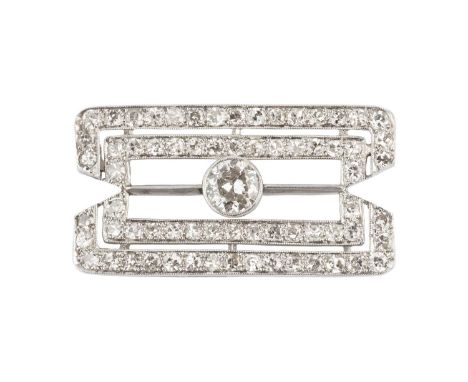 A diamond panel brooch, the shaped rectangular panel of pierced geometric design, centred with a transitional brilliant-cut d