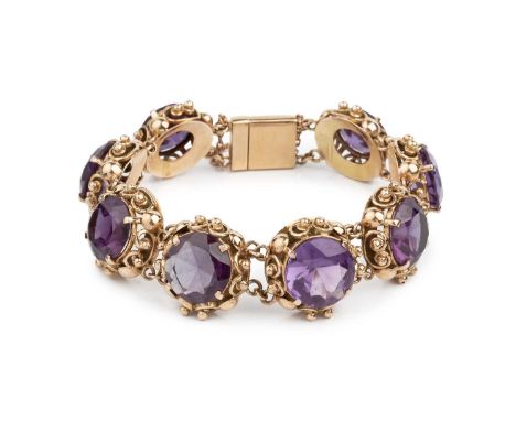 A synthetic gem set bracelet, designed as a series of circular mixed-cut synthetic colour change sapphires in claw settings, 