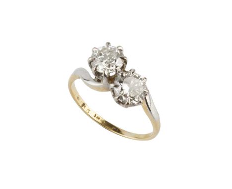 A diamond two stone crossover ring, the round brilliant-cut diamonds in eight claw settings, two colour precious metal mounte