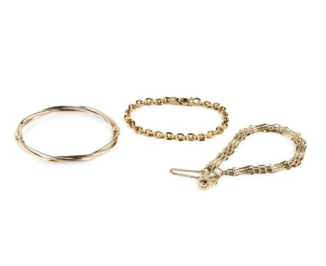 A three colour precious metal bangle, of hinged oval twisted design, stamped '375', together with a 9ct gold gate-link bracel